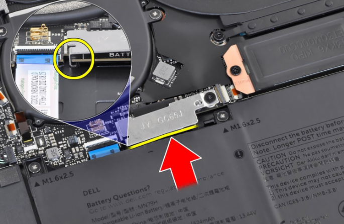Close-up of battery-connector bracket removal on XPS 13 9340